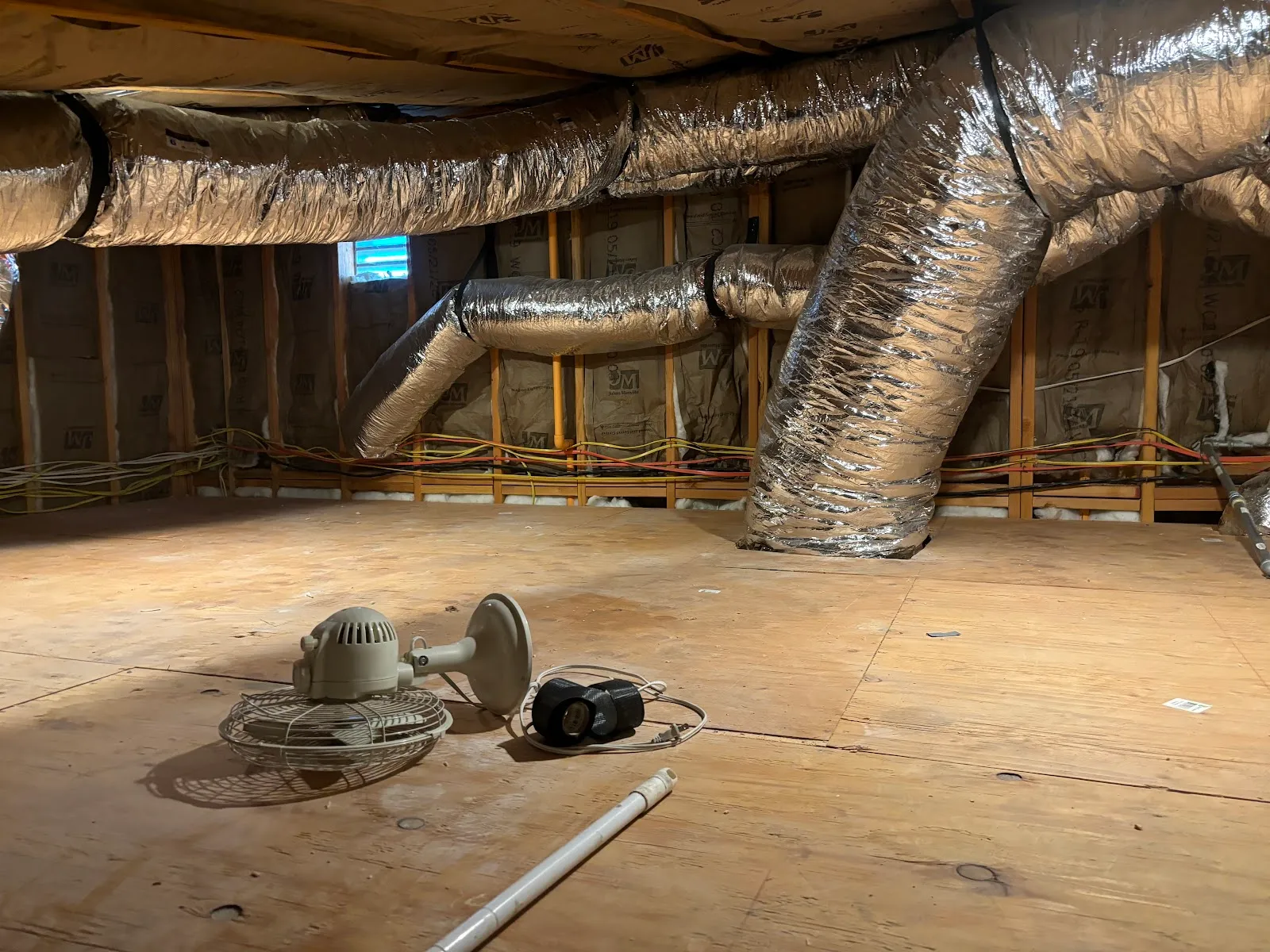 Insulated flex ductwork running through an attic